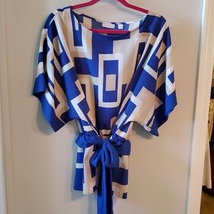 Multi colored belted blouse.